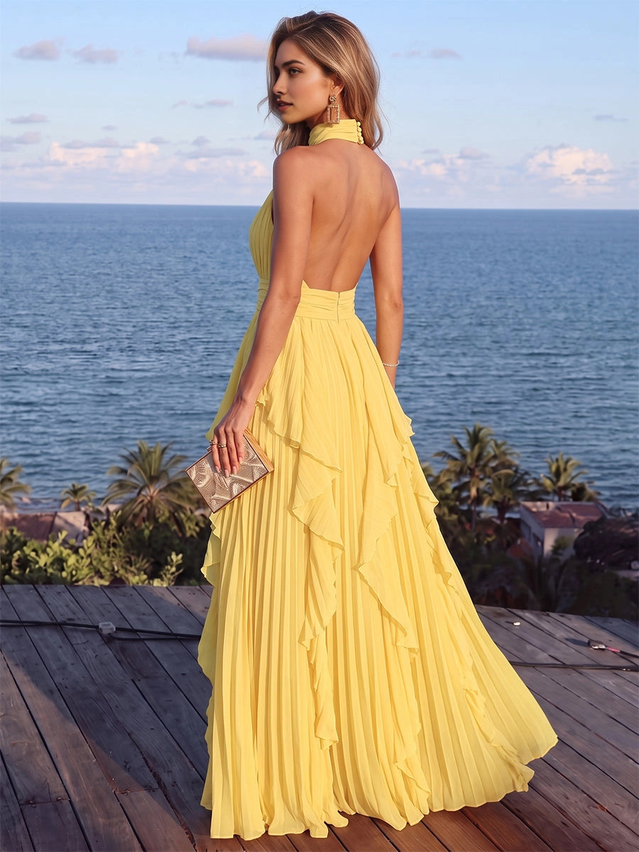 Vedress yellow chiffon prom gown back view,deep open back,halter tie closure,invisible zipper,flowy ruffle floor‑length skirt,ocean view scenery