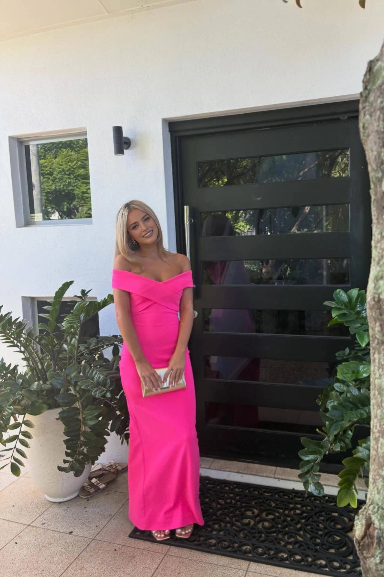 Back‑side shot Vedress seamless plain‑back hot pink off‑the‑shoulder fitted sheath formal gown