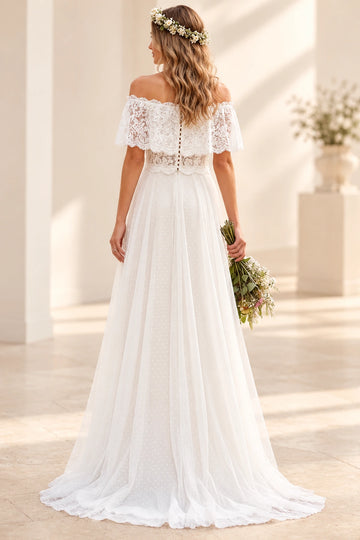 Vedress lace and dotted tulle wedding dress with an off-shoulder flounce, sheer button back and softly trailing A-line skirt, back view