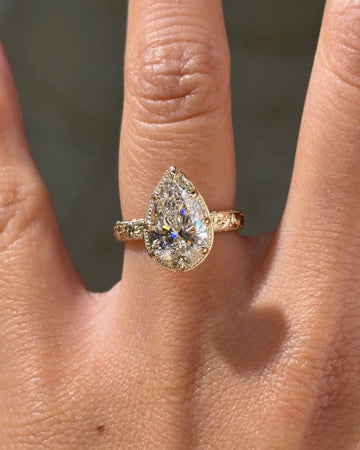 Vintage Pear Cut Engagement Ring with Engraved Gold Tone Band