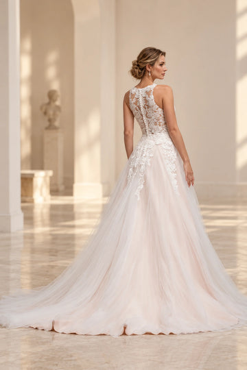 Back view of Vedress A-line wedding dress featuring a high sheer floral lace back, covered buttons and a flowing layered tulle train.