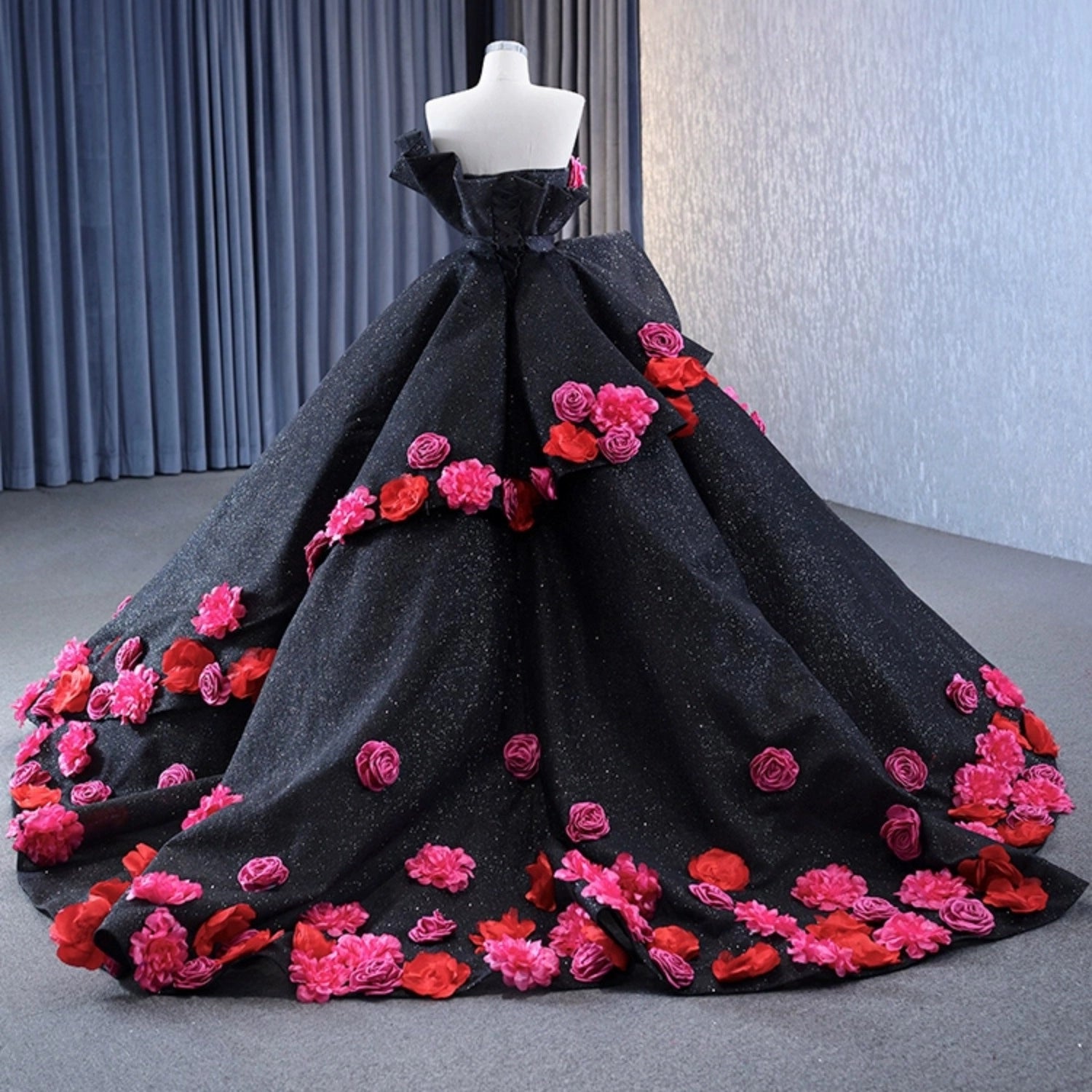 Vedress black glitter quinceanera ball gown sweep train strapless, scattered pink and red handmade 3D flowers back view