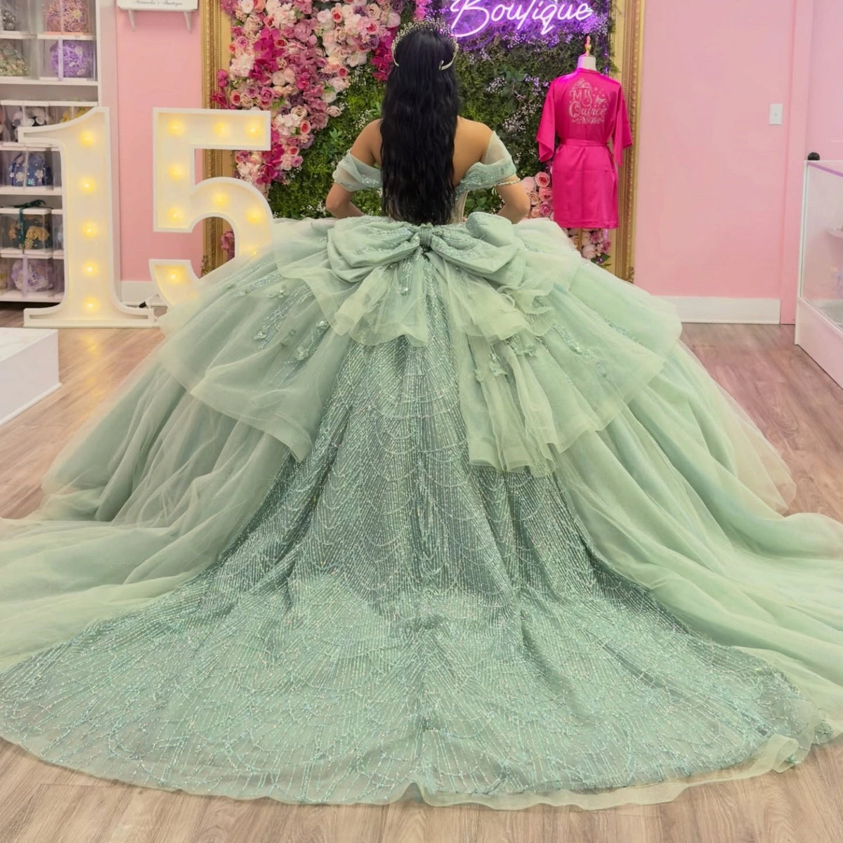 Vedress sage green quinceanera ball gown corset back cathedral train oversized tulle bow beaded scallop pattern off-shoulder back view