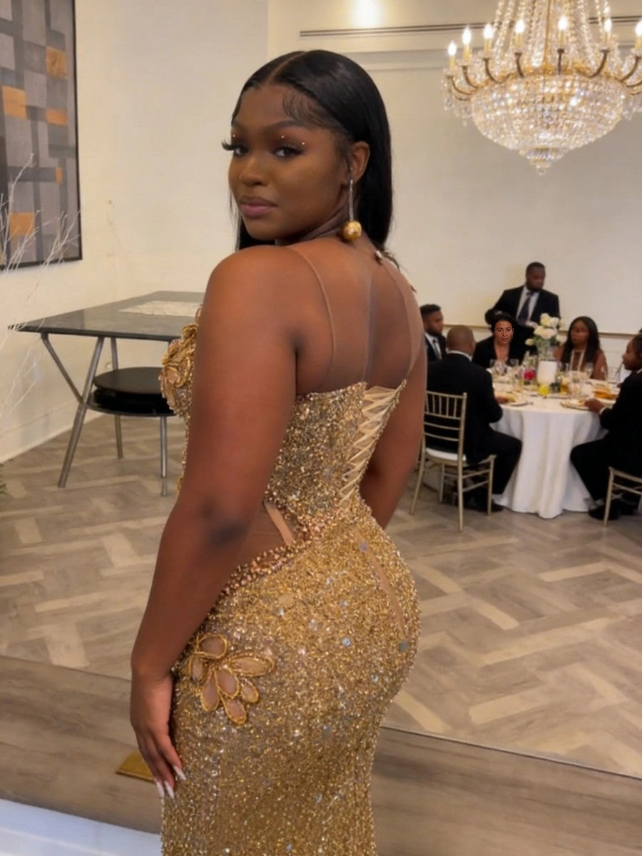Curvy model wearing vedress gold sequin plus‑size prom dress corset lace‑up back view