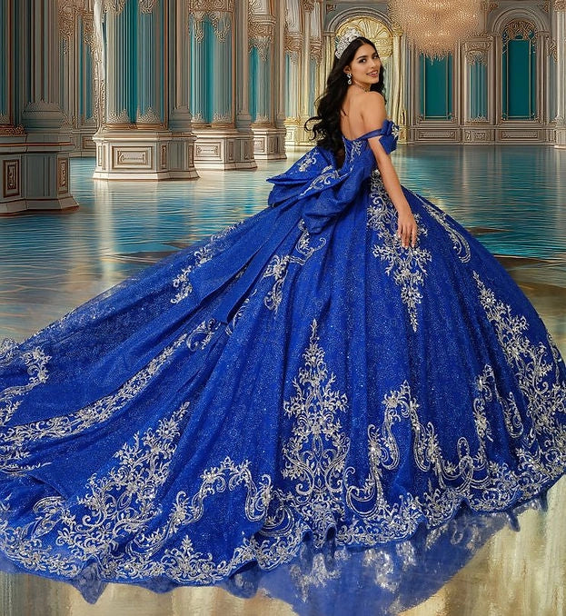 Back view Vedress royal blue quinceanera gown open back large bow long train silver embroidered ballgown