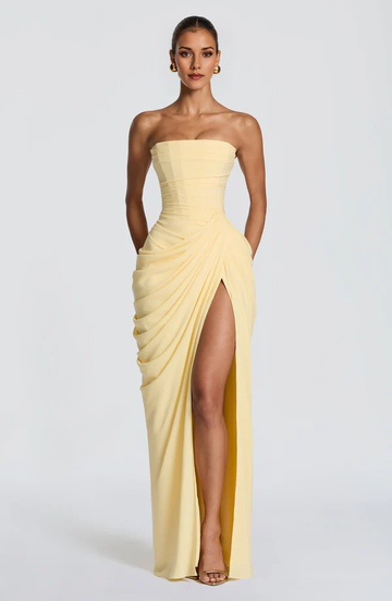 Strapless ruched sheath formal gown with high slit, sleeveless bodice, and draped skirt detail by Vedress
