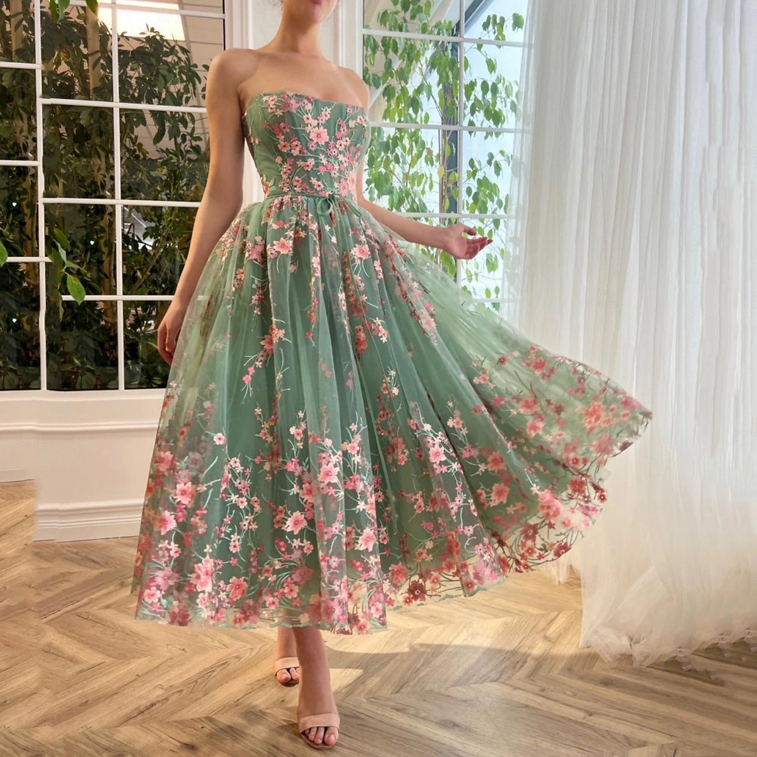 Vedress sage green floral embroidered strapless midi prom dress flowy skirt front view indoor garden background
