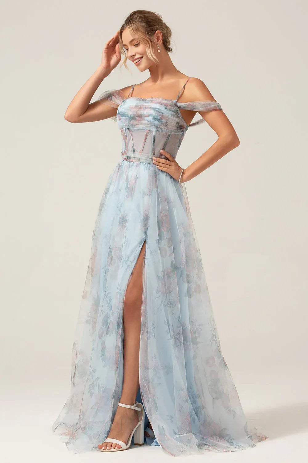 Romantic A-line prom gown with spaghetti straps, off-the-shoulder tulle drapes, floral print tulle, structured corset bodice, lace-up back and thigh-high slit