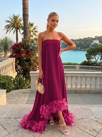 Vedress burgundy strapless maxi wedding‑guest gown with bright fuchsia feather skirt hem front view
