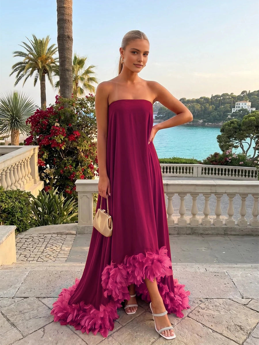 Vedress burgundy strapless maxi wedding‑guest gown with bright fuchsia feather skirt hem front view
