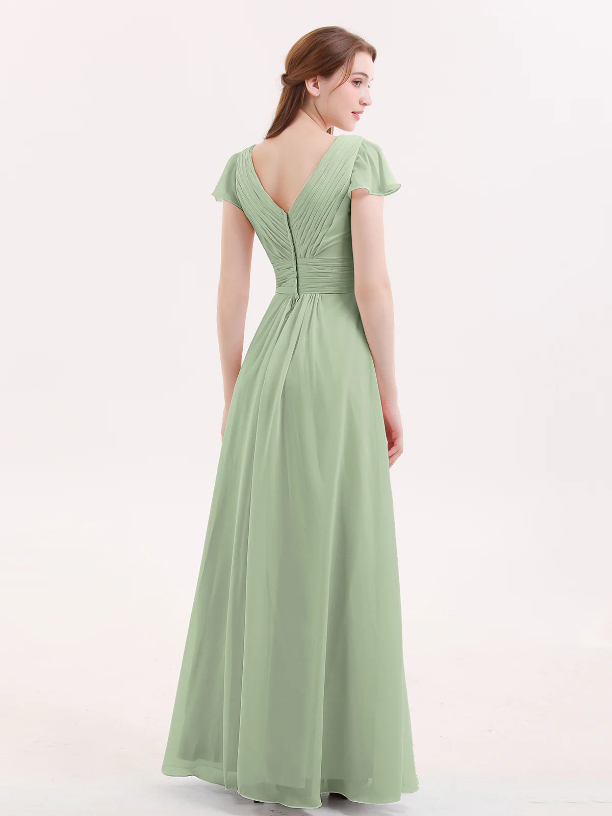 Back view of dusty sage chiffon bridesmaid dress with V-back design, flutter sleeves, ruched bodice, zipper closure, and flowy A-line skirt by VEDRESS