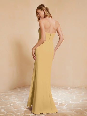 Back view of gold strapless bridesmaid dress with zipper closure, clean back design, floor-length skirt, and side slit by Vedress
