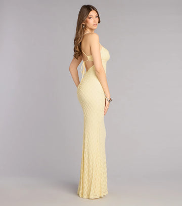 Back view of lace mermaid formal dress with spaghetti straps, open back, and lace-up tie detail
