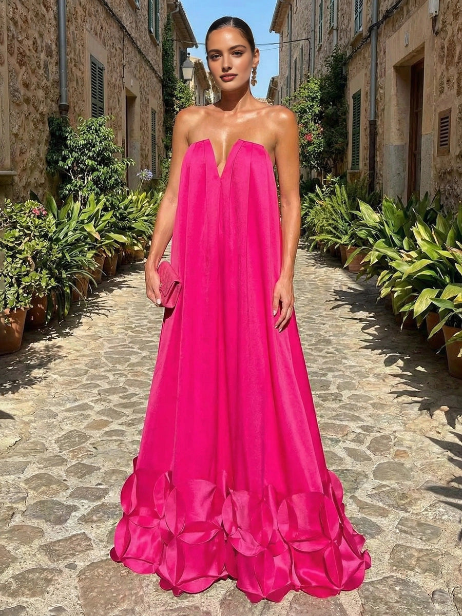 Vedress hot pink strapless long wedding guest gown with 3D petal skirt hem front view