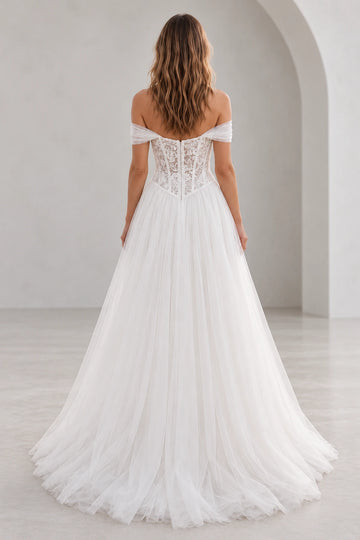Vedress tulle wedding dress with a sheer floral lace back, visible boning, central zipper and flowing A-line skirt, back view