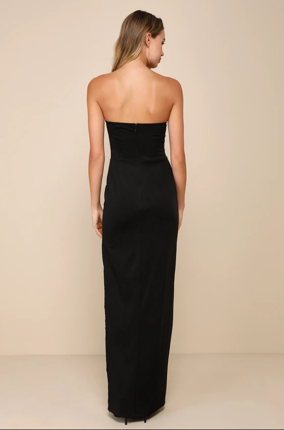 Back view of black strapless formal dress with open-back effect, center zipper closure, slim column silhouette, and floor length design by VEDRESS