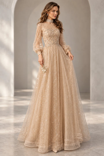 Front view of a Vedress champagne beaded tulle evening dress with an illusion round neckline, sheer bishop sleeves and a floor-length A-line skirt
