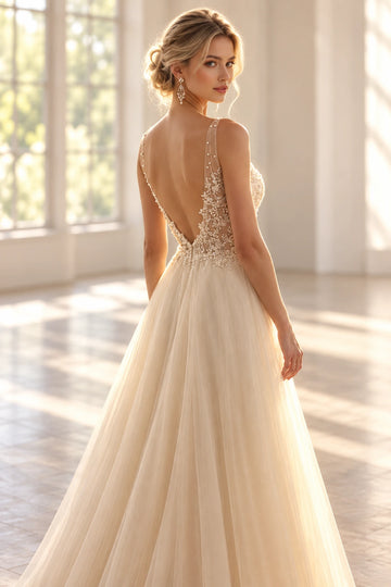 Back view of a Vedress tulle wedding dress with a deep V-back, sheer beaded shoulder straps and floral lace detailing around the waist