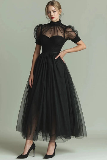 Black A-line tulle evening dress featuring a sheer high neckline, short puff sleeves, fitted sweetheart-style bodice and flowing ankle-length skirt.