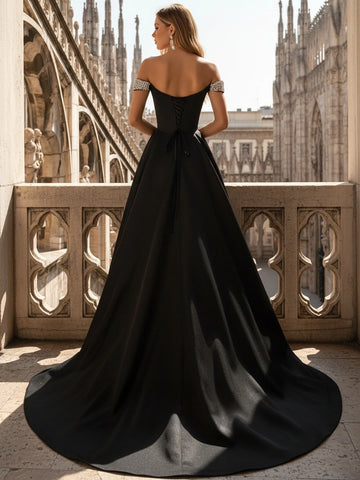 Black A-line prom dress with lace-up corset back beaded shoulder details and full floor length skirt