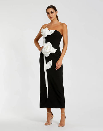 Black strapless midi wedding guest dress with oversized white 3D floral appliqués front view