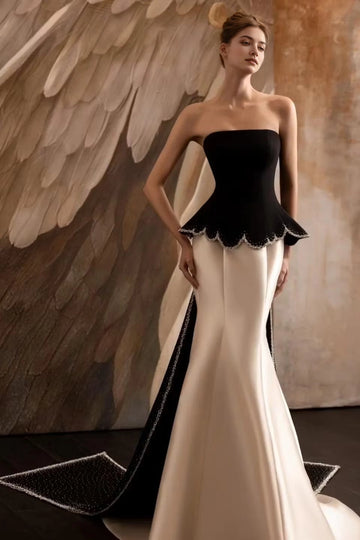 Black and white strapless mermaid evening dress with peplum waist and dramatic train by Vedress