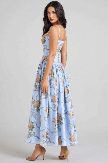 Back view of light blue floral midi dress with spaghetti straps, fitted bodice, A-line gathered skirt, and romantic floral print by VEDRESS