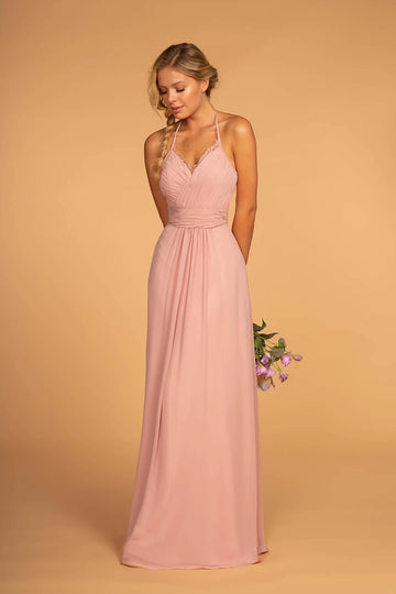 Blush pink A-line chiffon bridesmaid dress with a lace-trimmed V-neckline, halter straps, ruched waist, and flowing floor-length skirt by Vedress.