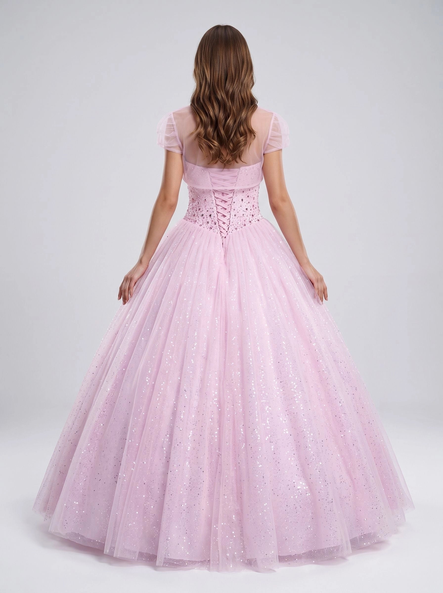 Blush pink floor‑length ball gown prom dress sweetheart heavily beaded bodice removable short puffed‑sleeve tulle shrug criss‑cross lace‑up back full sparkling glitter tulle skirt quinceanera gown by Vedress