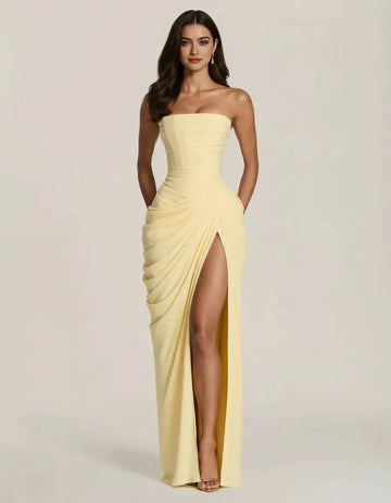 Butter yellow strapless prom dress with corset bodice ruched waist high slit and floor-length sheath silhouette by Vedress