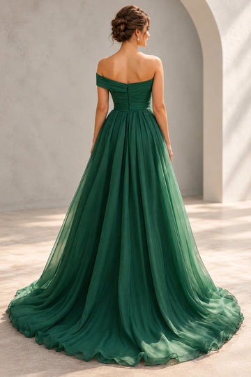 Back view of a Vedress emerald green chiffon prom dress with a pleated low back, center zipper and flowing A-line skirt with sweep train