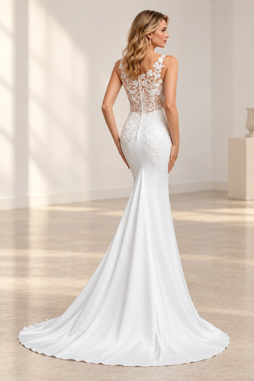 Back view of Vedress mermaid wedding dress with a sheer floral lace back, covered buttons, lace appliques over the hips and a satin train.