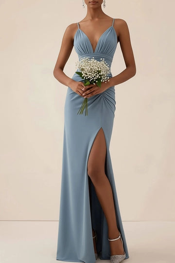 Dusty blue sheath bridesmaid dress with spaghetti straps, plunging V-neckline, gathered bust, ruched waist, thigh-high slit, and floor-length skirt by Vedress.