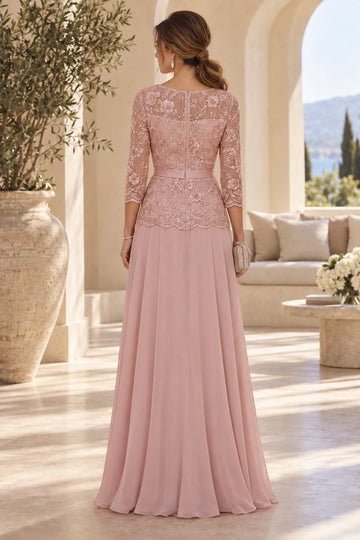 Back view of dusty rose mother of the bride dress featuring sheer floral lace back, center zipper, scalloped lace overlay and flowing A-line skirt