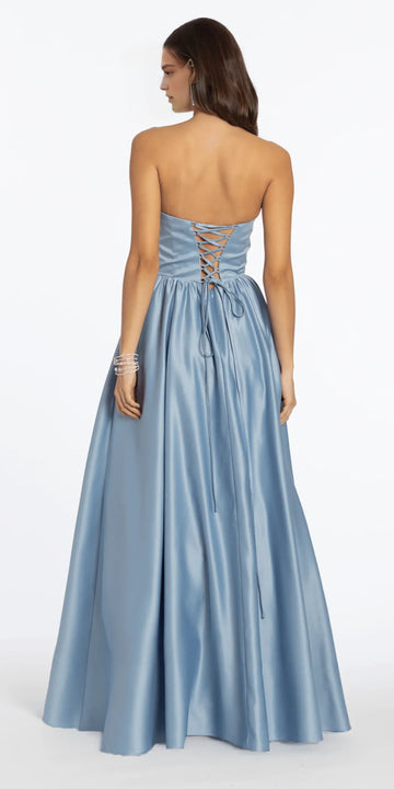 Back view of light blue satin ball gown with lace-up back, strapless bodice, full floor length skirt, and elegant formal gown design by VEDRESS