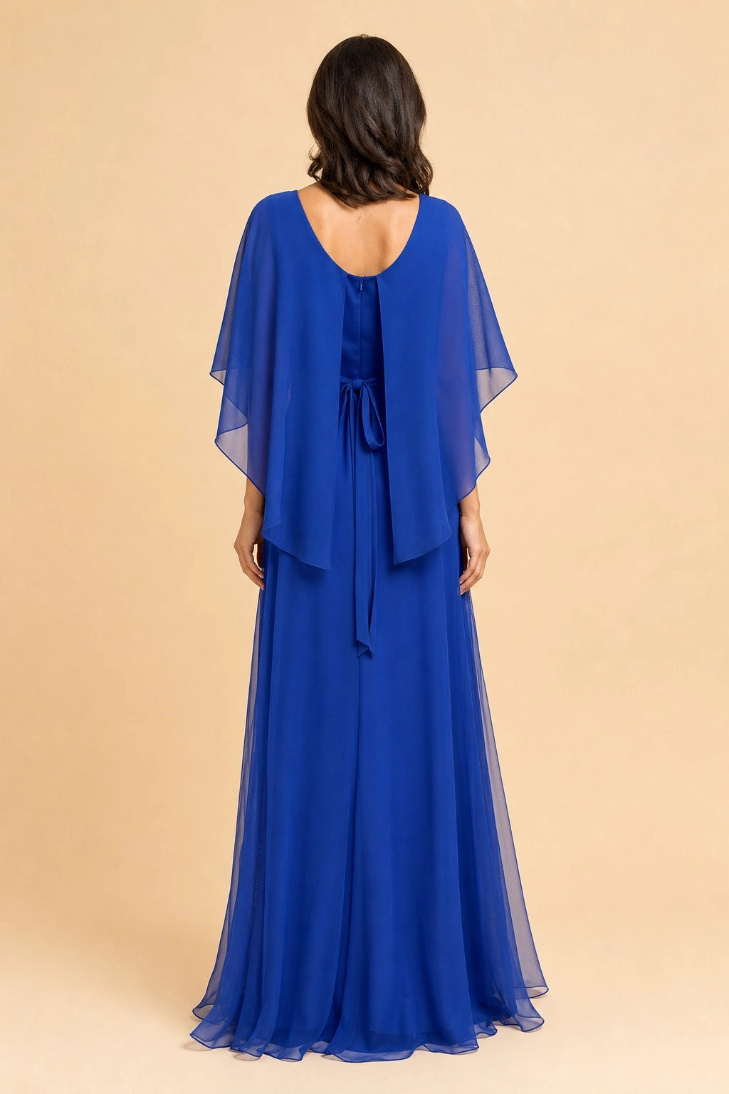 Vedress royal blue cape sleeve formal dress back view,low scoop back,invisible zipper,adjustable waist tie,flowy chiffon floor length skirt,neutral backdrop