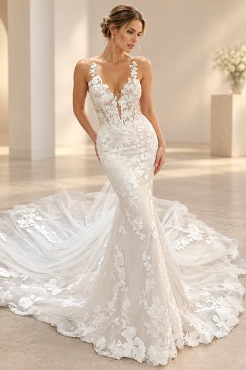 Vedress mermaid tulle wedding dress with dimensional floral appliques, a plunging V-neckline and delicate sleeveless straps, front view.