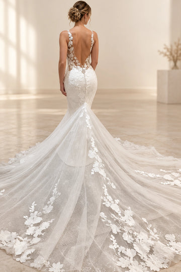 Back view of Vedress mermaid wedding dress with a deep V-back, covered buttons and a long tulle train edged with floral appliques.