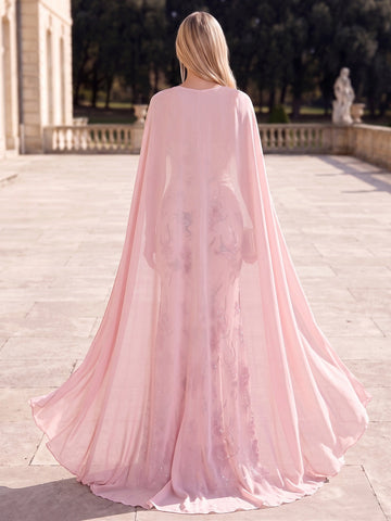 Back view of Vedress pink floral evening dress with a sheer floor-length cape covering the back.