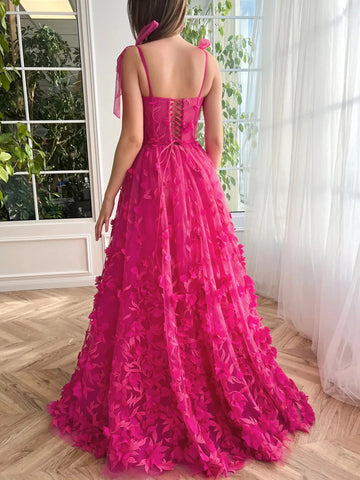 Back view of fuchsia floral prom dress with thin straps corset lace-up back and floor-length skirt
