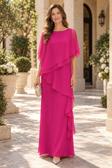 Fuchsia pink mother of the bride dress with a boat neckline, sheer flutter sleeves, asymmetric layered overlay and cascading side ruffles.