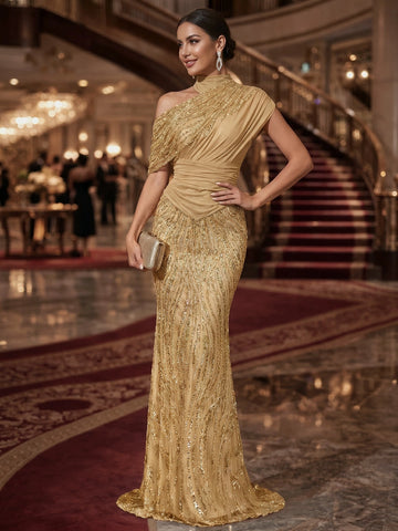 Gold sequin evening dress with an asymmetric neckline, draped cap sleeve, ruched waist, and floor-length fitted silhouette by Vedress.