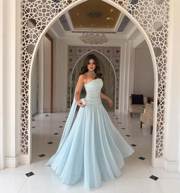 Ice blue one shoulder floor length prom dress with shimmering fitted bodice and flowing skirt by Vedress