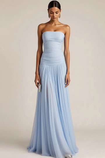 Light blue A-line bridesmaid dress with straight strapless neckline, ruched fitted bodice, dropped waist, and flowing floor-length chiffon-look skirt by Vedress.