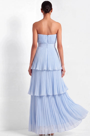 Back view of light blue strapless bridesmaid dress with vertical bodice pleats, center-back zipper, defined waistband, and cascading tiered skirt.