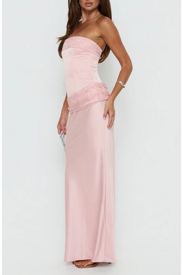 Light pink strapless sheath prom dress with a straight neckline, delicate floral lace trim, asymmetric hip detailing and floor-length skirt.