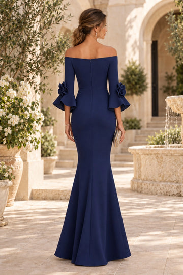 Back view of navy blue mermaid mother of the bride dress featuring off-shoulder straight back, center zipper, floral bell sleeves and fitted flared skirt