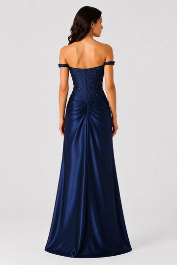 Back view navy wedding guest dress with straight neckline fitted bodice and ruched floor-length skirt
