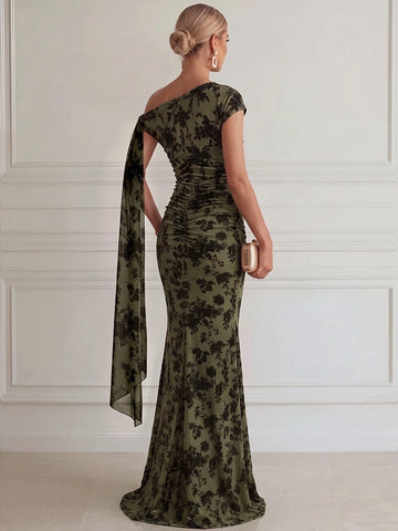 Back view of olive green floral mermaid dress featuring asymmetric shoulder design, gathered back ruching and long draped sash.