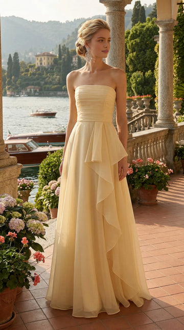 Pale yellow strapless chiffon wedding guest dress with draped A-line skirt
